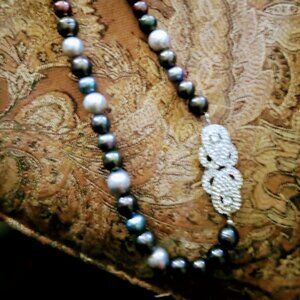 Heavy pearls irregular shapes. Not knotted. Rhinestone clasp